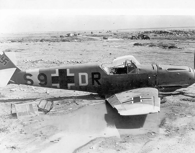 Messerschmitt-Bf-109E7BTrop-7.ZG1-S9+DR-sd-during-a-strafing-attack-at-Fuka-Egypt-1942-02